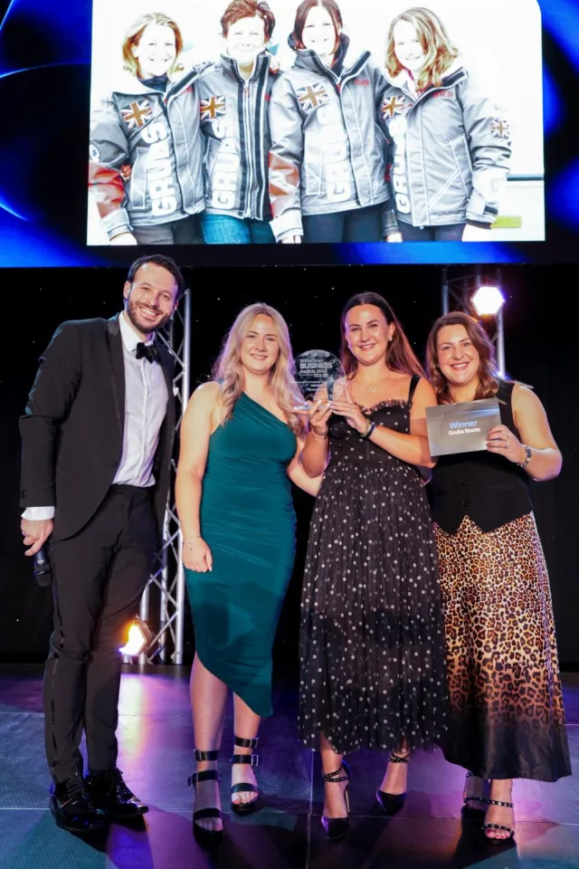 The Grubs Boots family team proudly receiving the Retail, Leisure & Hospitality Business of the Year Award